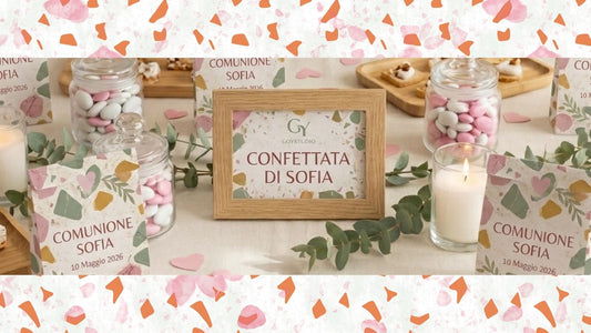 Allestimento elegante con packaging Terrazzo GOYSTUDIO: scatoline e sacchetti con texture graniglia colorata su tavolo in legno, perfetti per matrimoni, battesimi e cerimonie.