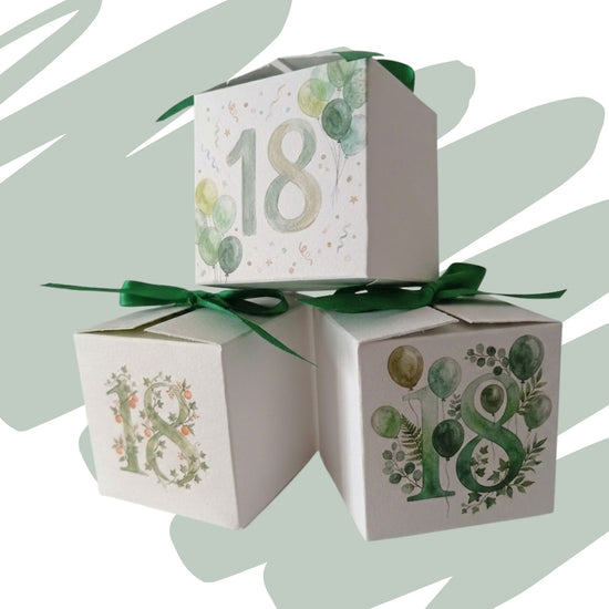 breve video che mostra 3 scatoline in cartoncino portaconfetti per 18 anni con diverse fantasie di foglie e palloncini 